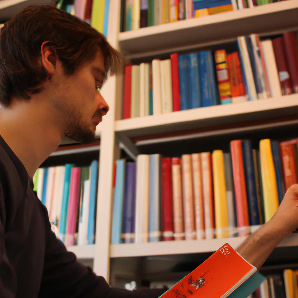 Person studying books in library